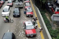 Money rain in hong kong prompts sprint for free cash money on road