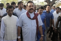 Mahinda rajapaksa agrees to step down as party boss
