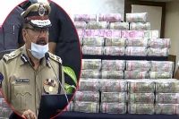 Bundles of huge hawala money tumble out of car in banjara hills