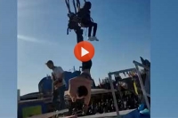 Girl comes that close to losing head on carnival ride