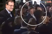 Spain pm punched in the head during campaign appearance
