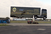 Giant truck jumps over speeding lotus f1 racing car in sensational world record stunt