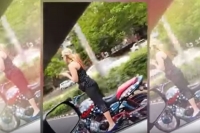 Girl performing bike stunt in chandigarh fined