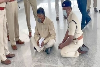 Tdp chief naidu squats at renigunta airport in protest as cops deny entry into tirupati