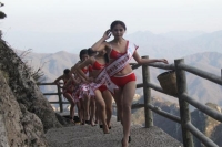 Ladies cat walked on a mountain with wearing bikini