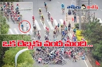 Careless jaywalker causes mass pile up in china cycle race