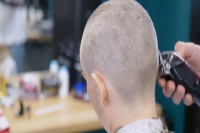 Dad makes 16 year old daughter shave her head after she bullies a girl with cancer