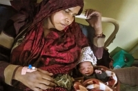 Delhi woman delivers miracle baby hours after being attacked and kicked in the stomach by rioters