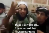 Shocking video shows isis fighters bartering for young women at slave girl market