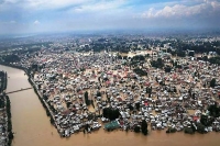 Death toll climbs in flood hit india and pakistan