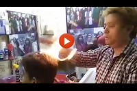 An indian barber who lights people s hair on fire to give a cut