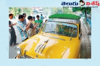 Green taxi in kolkata roads attracts people view