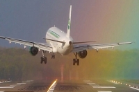 Germanair plane makes crosswind landing in a rainbow
