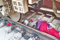 Mother child escape miraculously after falling under moving train at katpadi railway station