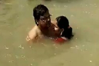 Viral video man attacked for kissing wife in ayodhya s sarayu river cops say probe underway