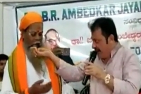 Karnataka congress mla eats food chewed spit out by dalit seer