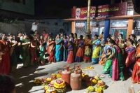 Telangana women unique protest against centre play bathukamma with lpg cylinders