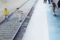 Cops dramatic rescue of 18 year old boy who jumped in front of train