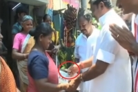Tamilnadu cm edappadi palaniswami caught on camera giving cash to voters in salem