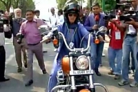 Congress mp ranjeet ranjan rides a bike to the parliament