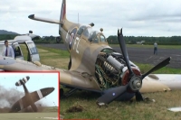 Airshow spectators in france rush to save spitfire pilot after crash