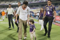 Srk attends kkr match with abram showers kisses on fans