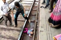 Train passes over 1 year old in up baby survives without a scratch