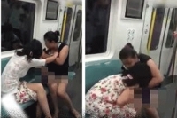 Two women fight over train seat in bizarre tussle on beijing subway