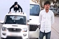 Man does push ups atop moving car up police rewarded him