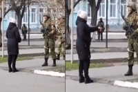 Ukrainian woman confronts russian soldiers hailed as fearless