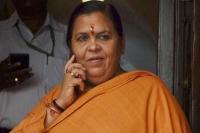Bureaucrats there to pick up our slippers says bjp leader uma bharti