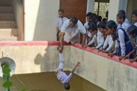Viral video of class 2 boy dangled by foot leads to up principal s arrest