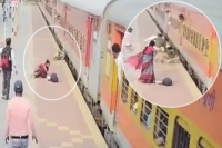 Brave rpf officer saves woman from crushing under train at purulia station in west bengal