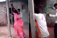 Man beating his wife and her lover