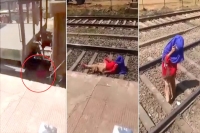 Viral video woman calmly talks on phone as train passes over her
