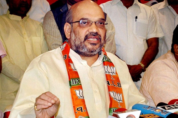 Amit shah asks party leaders to defend modi government