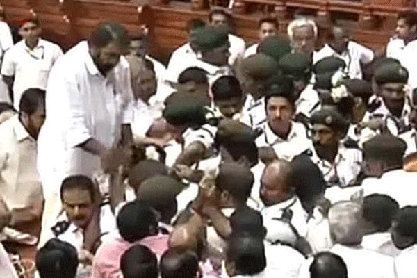 Speaker s chair toppled mics flung as kerala finance minister presents budget